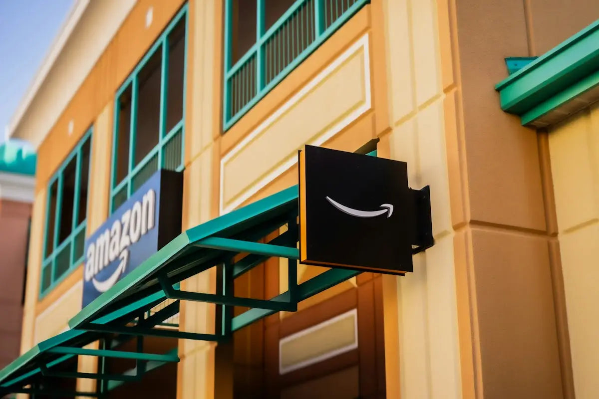 Black amazon logo sign with white smile arrow representing affordable home essentials online shopping guide.