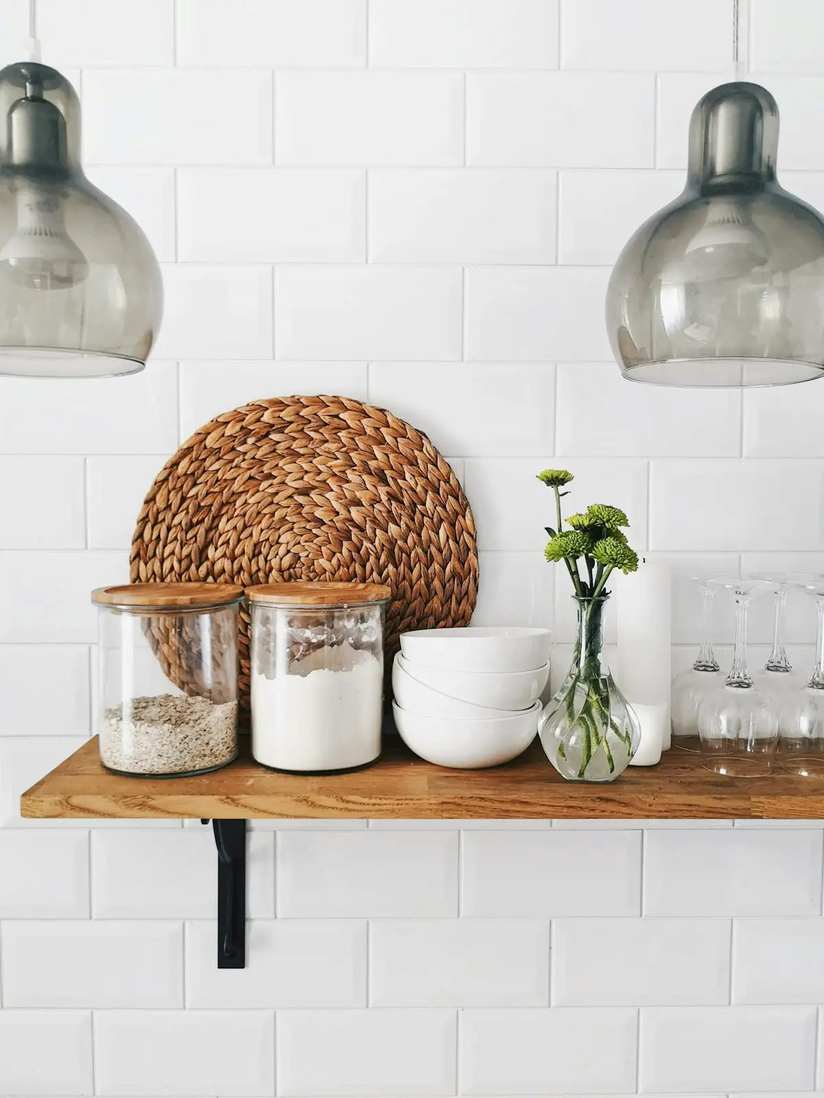 A round woven wicker placemat with a natural brown hue and textured surface for affordable smart home essentials.