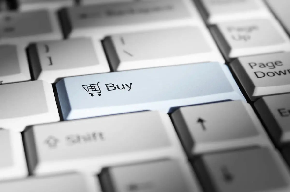 A light blue keyboard key with a shopping cart icon and buy text for shop arba global electronics and fashion essentials