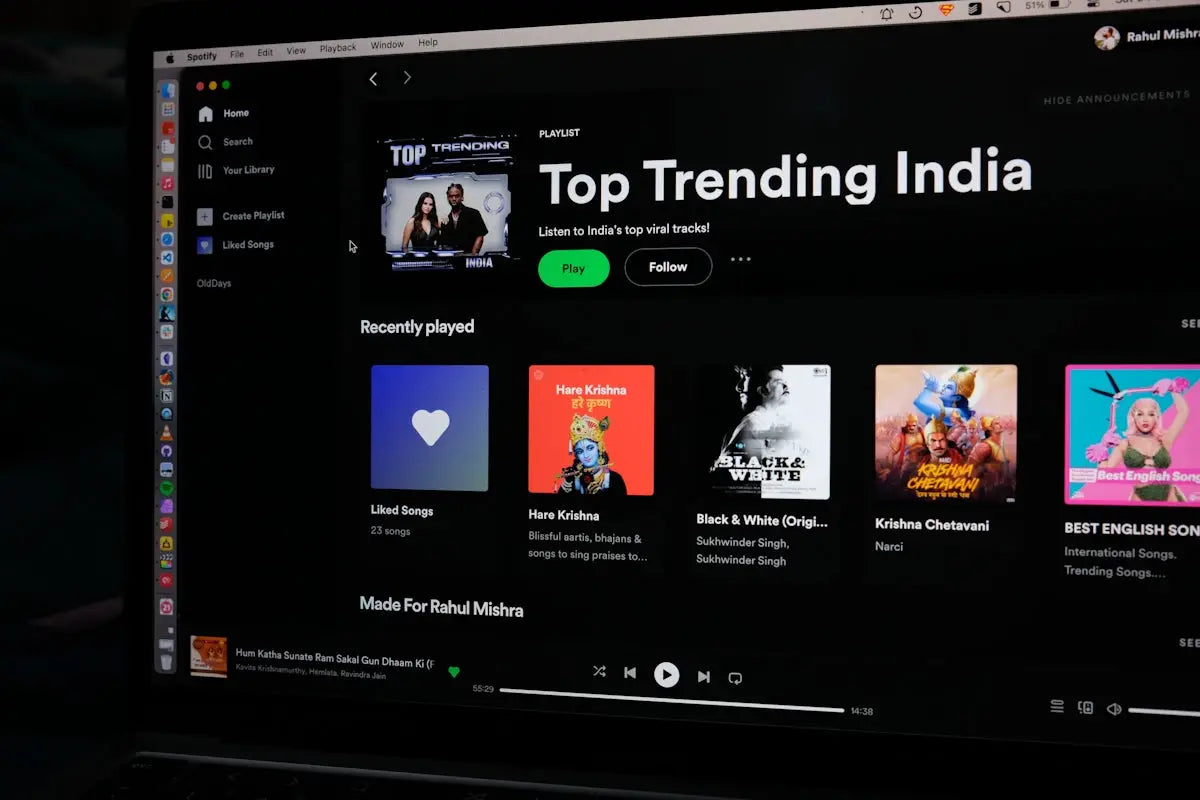 A computer screen displaying the spotify music streaming interface with the top trending india playlist for online shopping articles