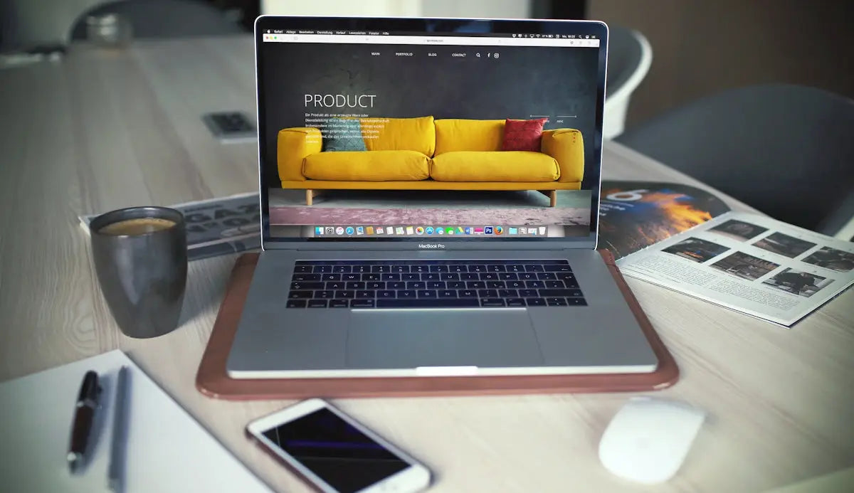 Silver macbook pro with brown leather case around its base shown from the back in ecommerce success article