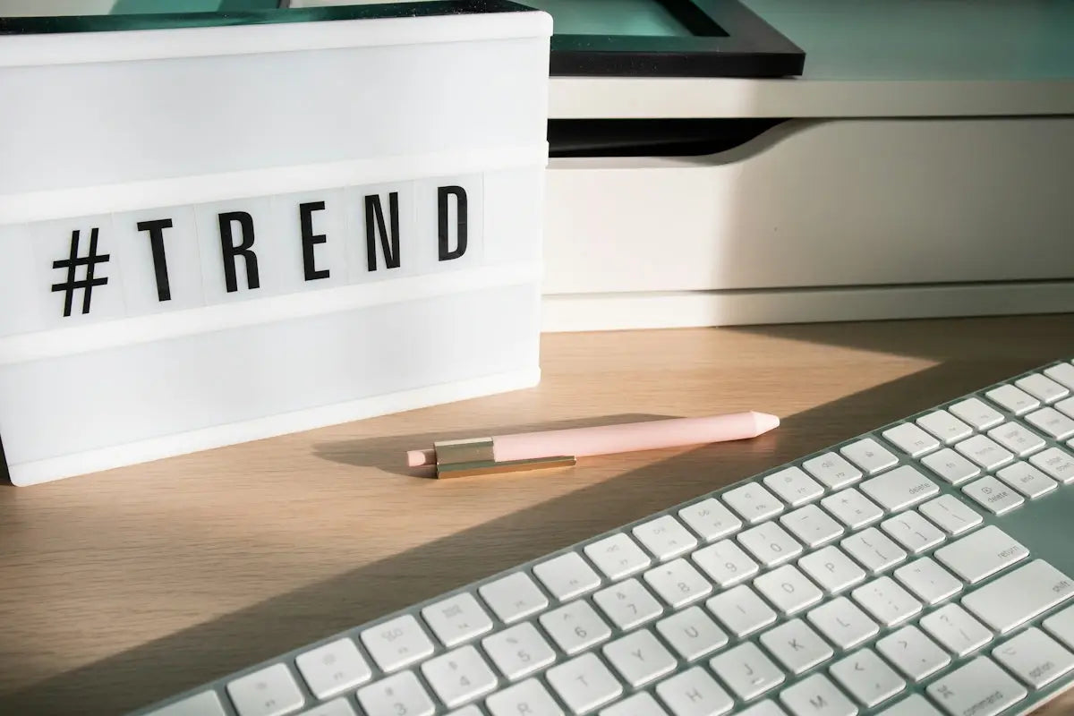White illuminated sign displaying the hashtag trend in bold black letters for trending online tech and lifestyle products