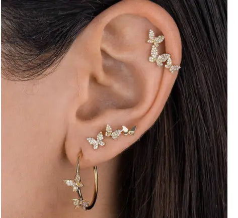 gold-toned butterfly and diamond alloy stud earrings adorned with clear sparkling crystals featuring a delicate and intricate design