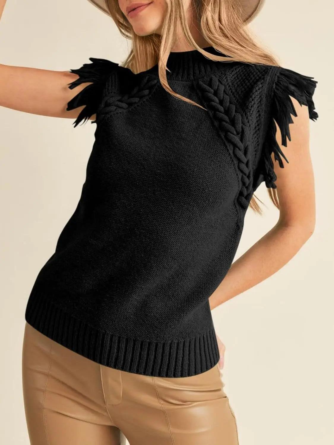 black hand-woven sleeveless knit sweater vest with braided shoulder details and fringe trim