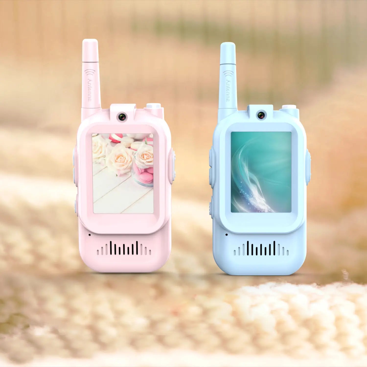 Kids video walkie talkies 2 pack rechargeable intercoms in pink and light blue with rounded plastic casings small screens displaying floral and abstract images and antennas.
