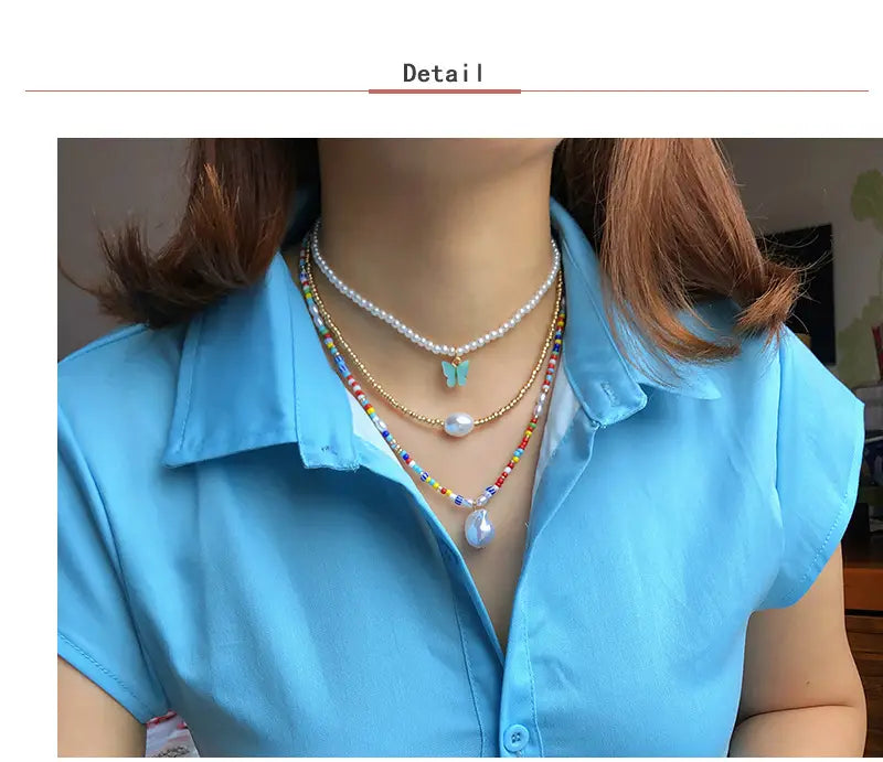 Elegant pearl butterfly charm choker necklace featuring layered delicate pearl strand, gold-toned beaded chain with colorful glass beads and central white pearl pendant, and multi-colored bead necklace with turquoise butterfly charm.