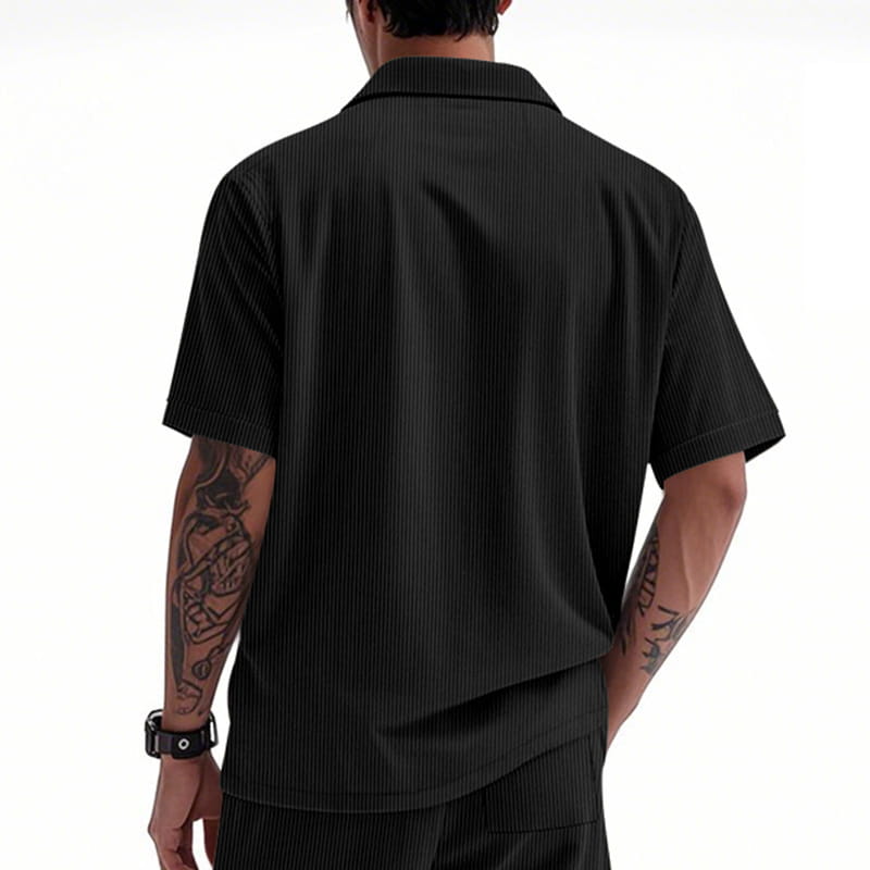 Black short-sleeved collared loose corduroy workwear shirt with a vertical ribbed texture.
