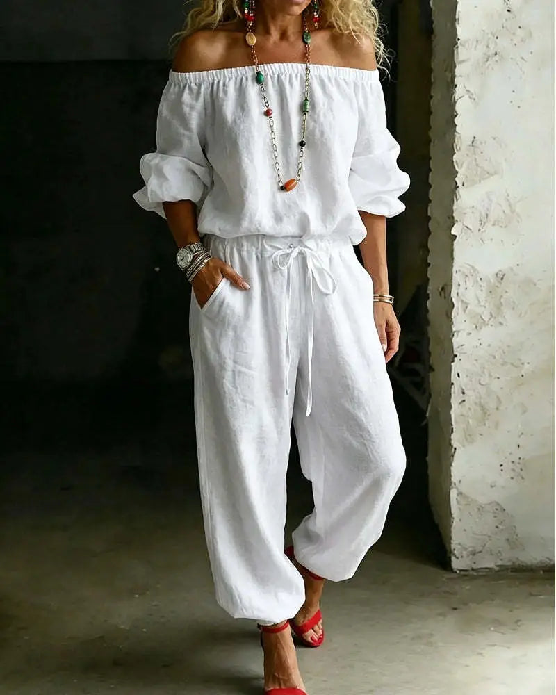 white linen off-shoulder jumpsuit with drawstring waist and loose tapered legs in a linen off-shoulder jumpsuit set