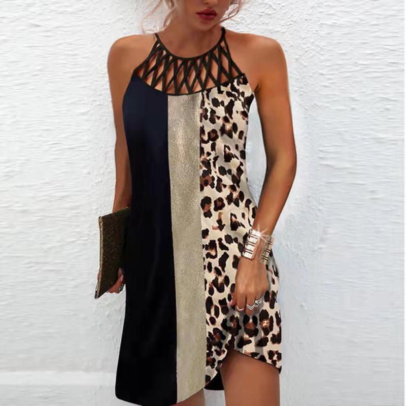 A stylish halterneck midi dress with an asymmetrical hem featuring bold black, metallic silver, and leopard print panels.