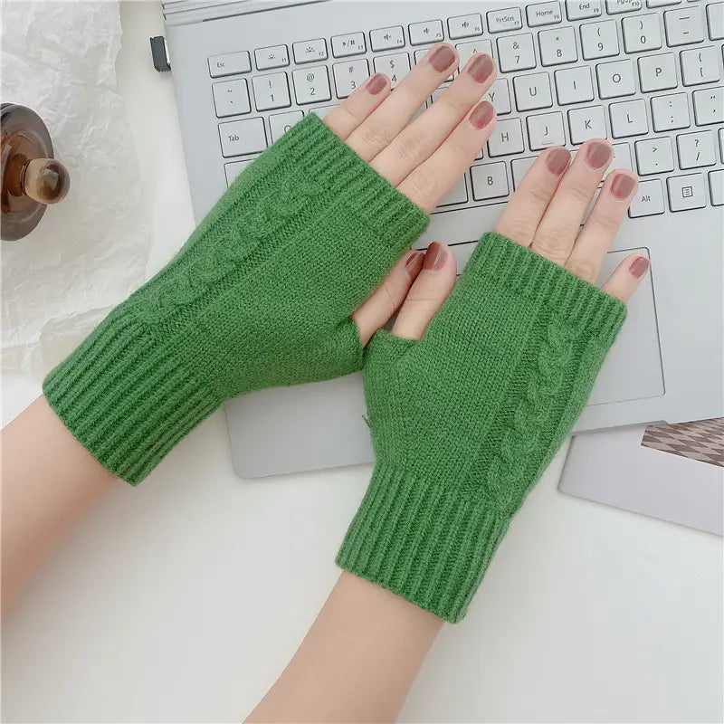 Green woolen cable knit fingerless gloves with ribbed cuff shown from the back side for unisex use