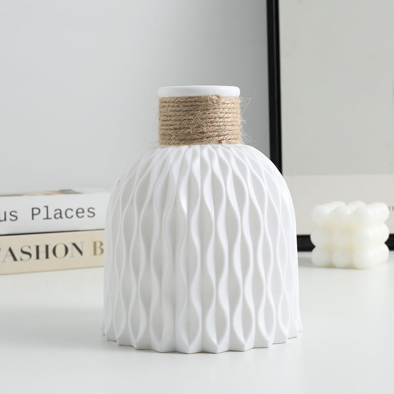 white ceramic vase with textured wavy pattern and natural twine band around the neck from a ceramic vase set with twine and wavy texture 4 pack