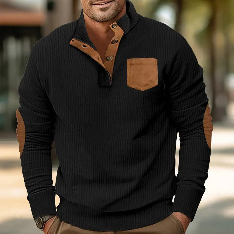 Black slim fit pullover sweater featuring ribbed knit fabric with brown suede corduroy patchwork accents on the collar, placket buttons, chest pocket, and elbow patches.