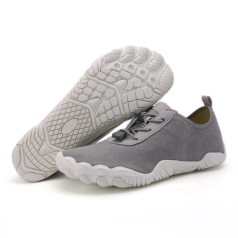 breathable non slip mesh water shoe in gray suede-like material with a white rubber sole and black laces designed for beach and trekking use