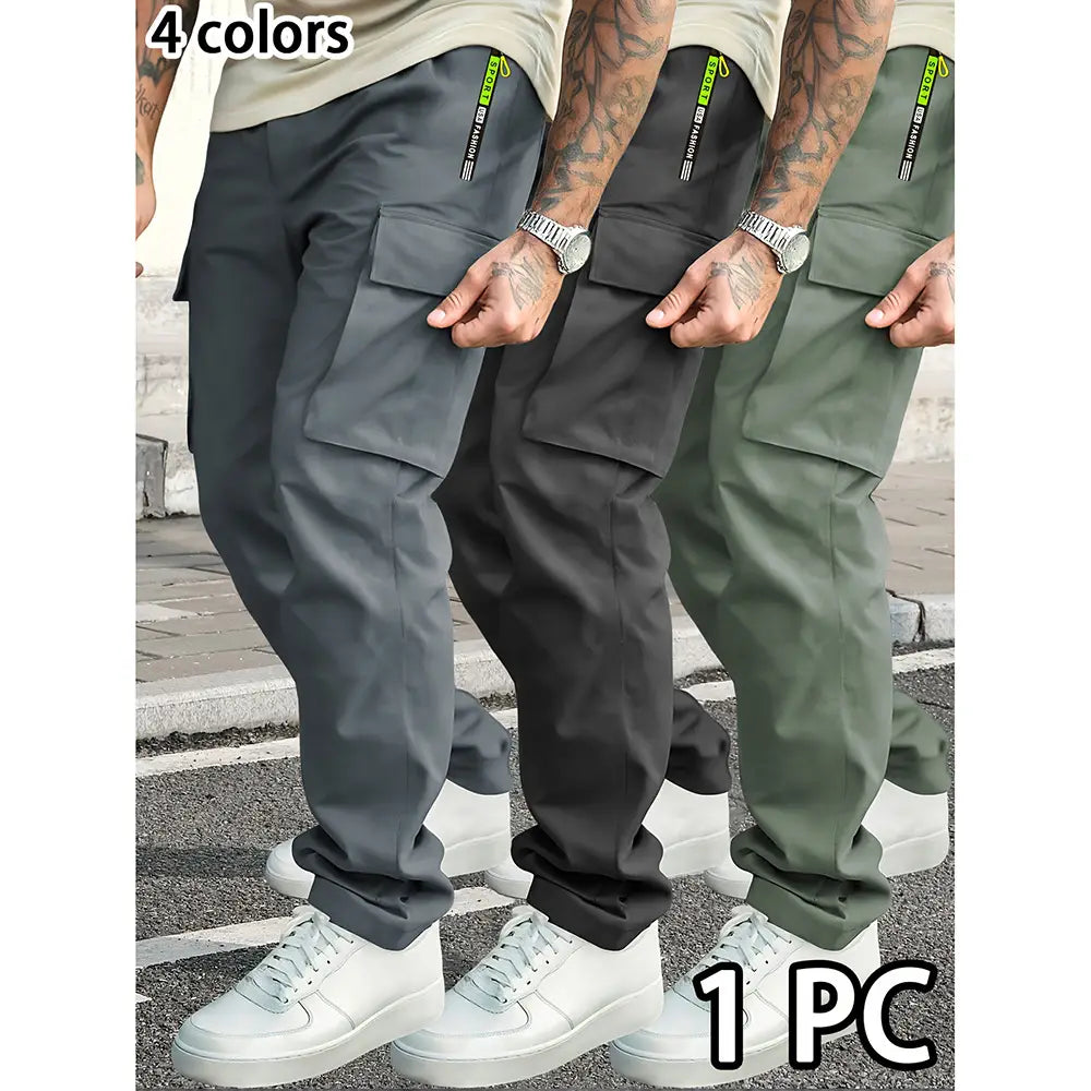 Men’s loose fit neon accent cargo joggers in dark gray with multiple pockets and a subtle green logo on the side seam.