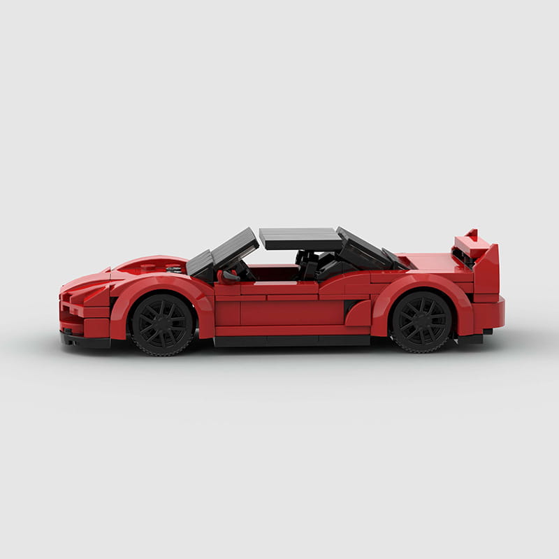 Roter Lego-Technic-Sportwagen-Baukasten als Spielzeug, mit einem roten Cabrio-Design mit schwarzen Rädern und Dach.