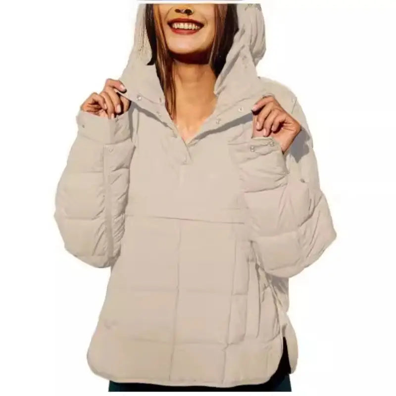 Beige quilted hooded puffer jacket for women featuring a warm insulated design.