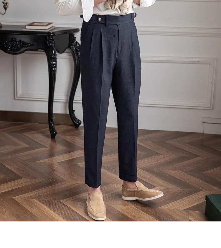Men’s slim fit pleated summer linen suit trousers in dark navy with a tailored fit and buttoned waistband.