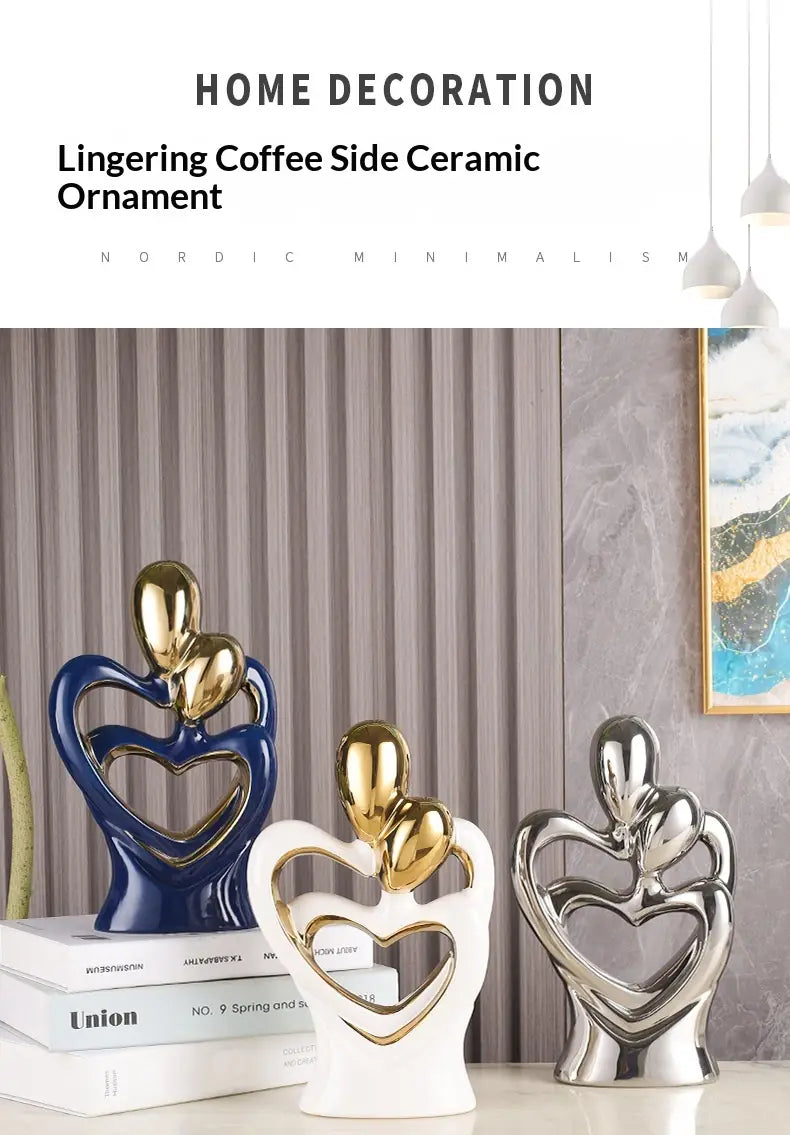 Three abstract heart ceramic figurines featuring stylized couples embracing in blue white and silver metallic finishes for modern home decor.