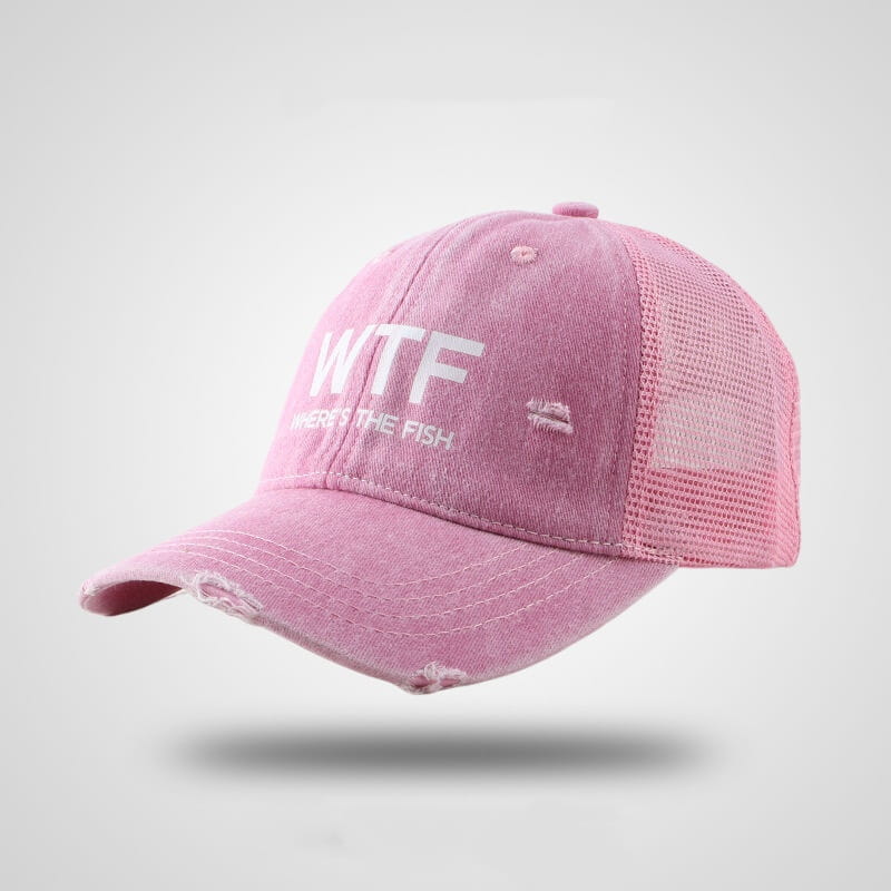 Pink distressed fishing trucker hat with white wtf wheres the fish embroidery and mesh back panel.