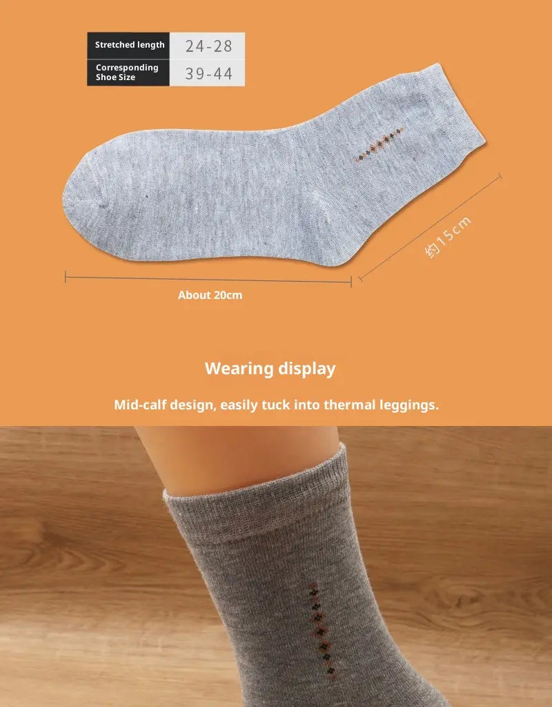 Men mid calf crew sock in gray with subtle dotted pattern and ribbed cuff made from soft breathable material.