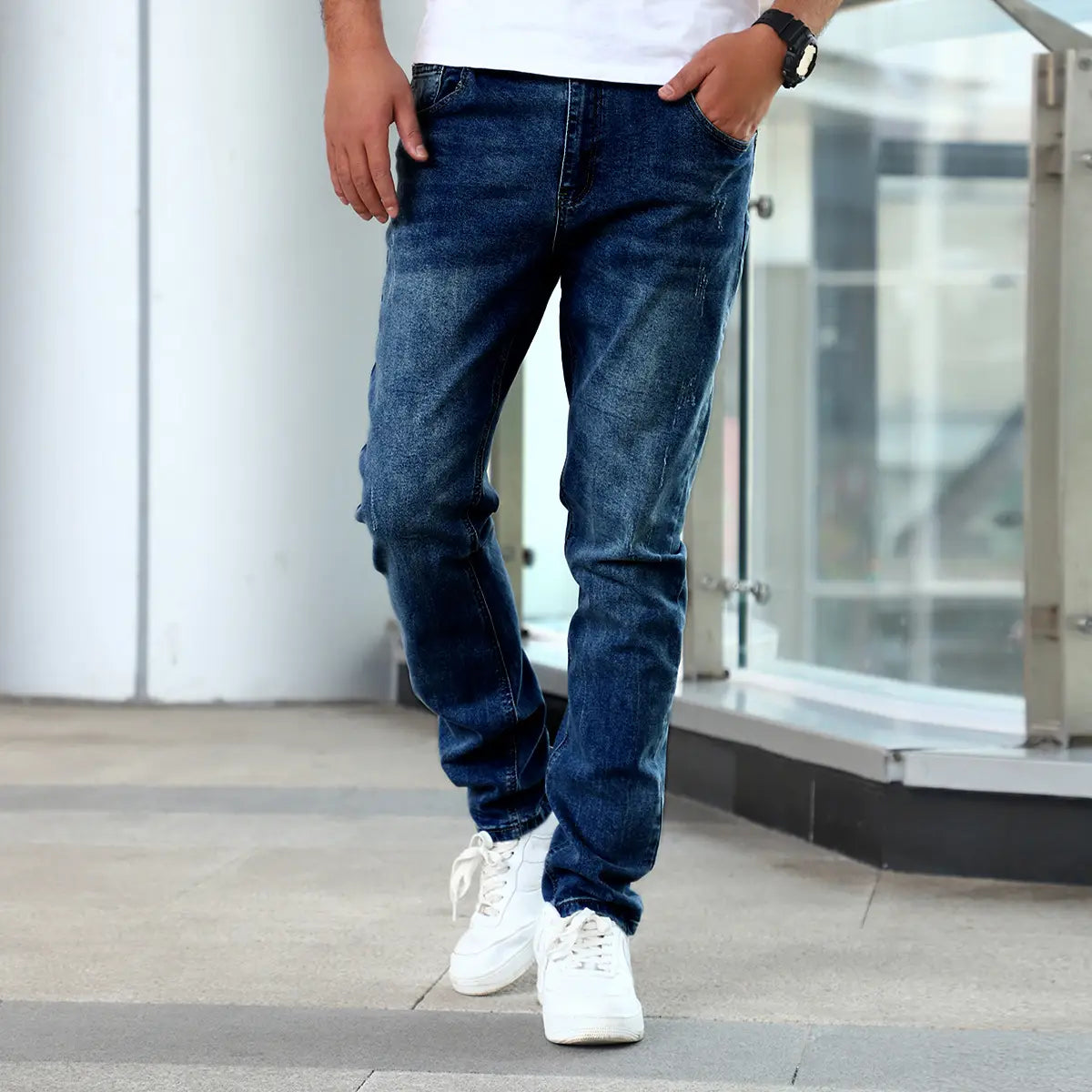 Men’s slim fit distressed dark wash denim jeans in dark-wash with a slim fit and subtle fading.