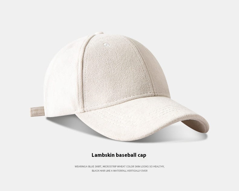 A soft off-white suede baseball cap with a curved brim and subtle stitching details from the suede baseball cap soft minimalist adjustable hat collection.
