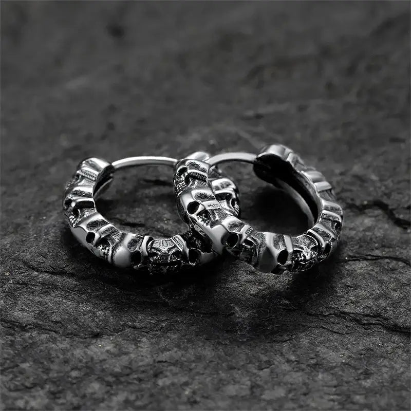 Silver unisex vintage textured skull hoop earrings featuring intricate detailed design.