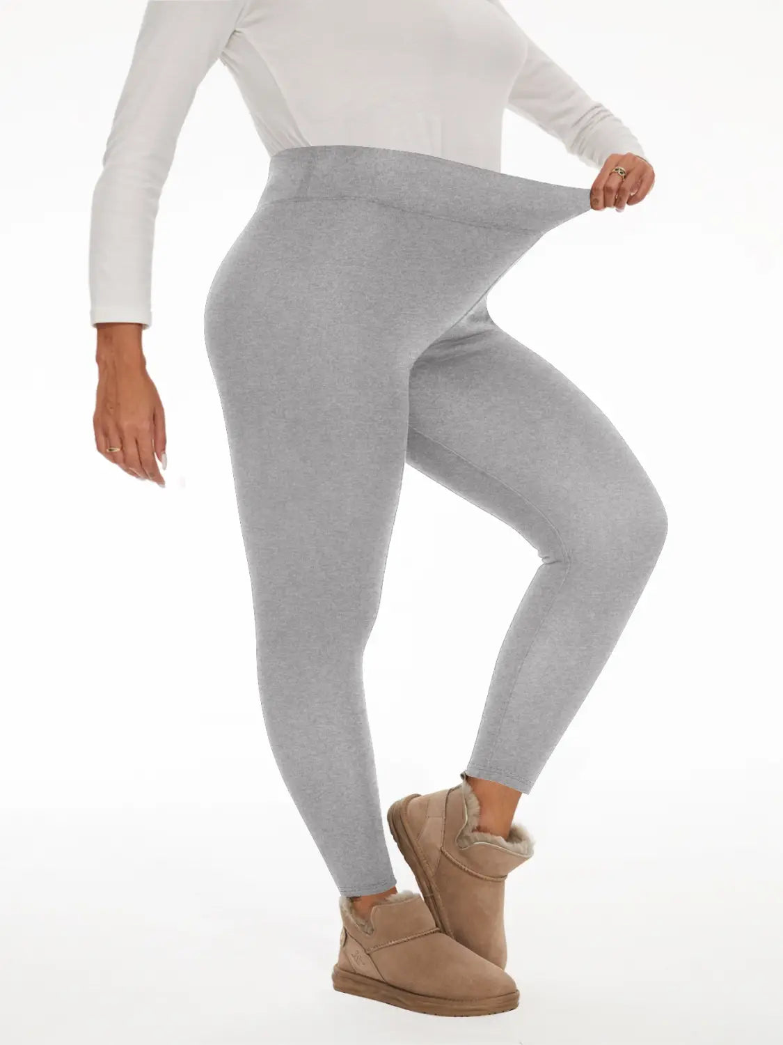 gray fleece lined high waisted winter leggings made of soft stretchy fabric featuring a high waistband for added comfort and warmth.
