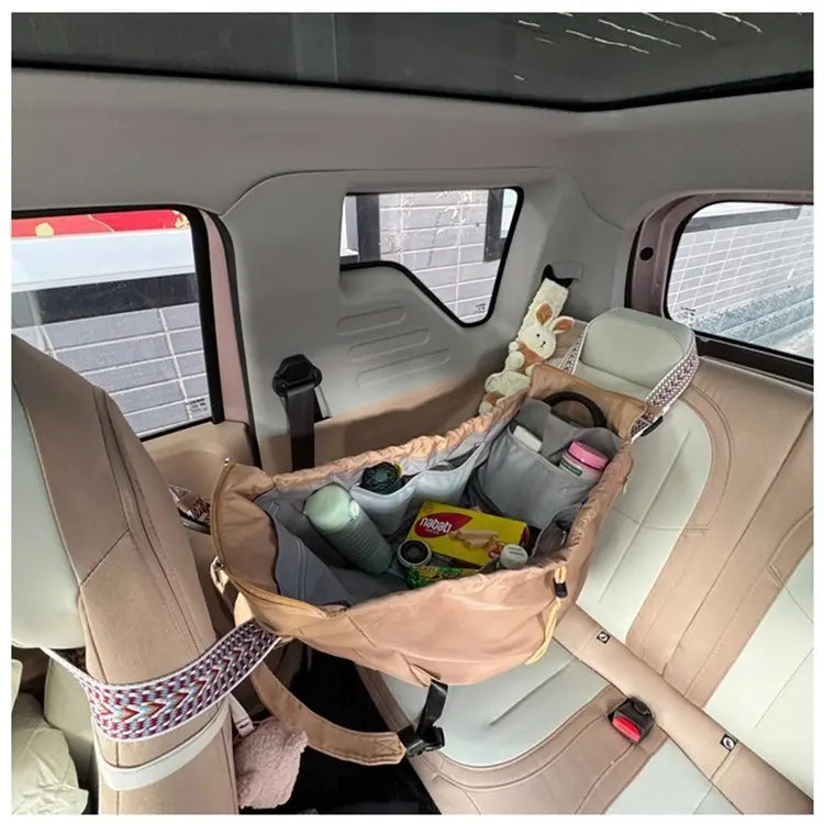 beige fabric car seat organizer with patterned straps and multiple compartments shown from the back side of multifunctional waterproof nylon fashion tote and backpack