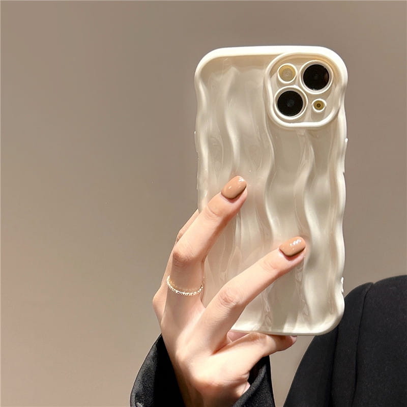 Cream-colored wavy liquid silicone iPhone case with a textured back surface design.