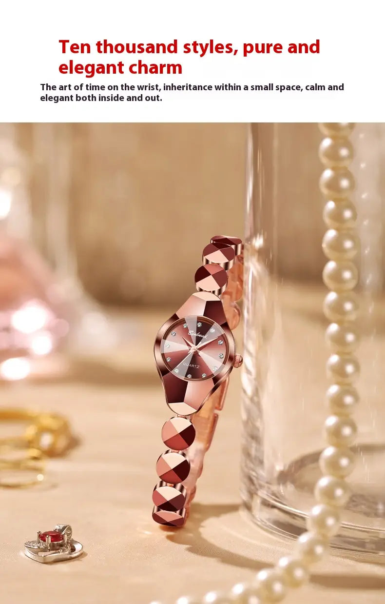 Rose gold-toned luxe geometric faceted bracelet watch with a silver dial and diamond-like hour markers.