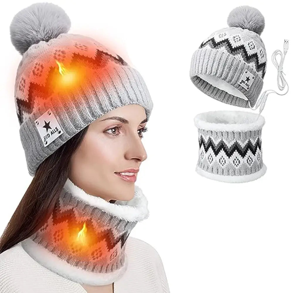 Gray knitted usb heated winter hat and matching scarf set featuring a black and white geometric pattern, fluffy pom-pom on top, and heated neck warmer with soft fleece lining.