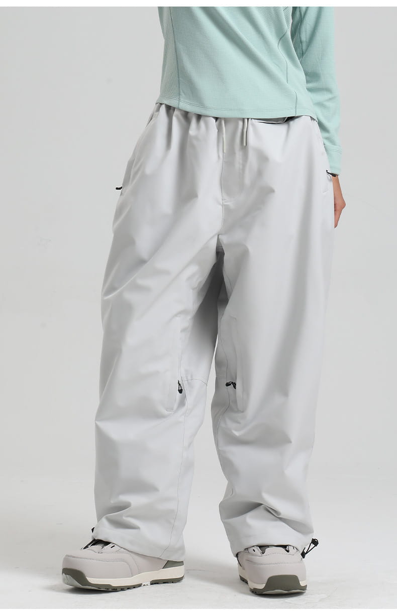 light gray waterproof windproof snow pants with a drawstring waist and adjustable cuffs designed as loose work trousers