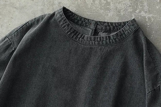 Retro artistic plus size dark gray denim tunic dress featuring a relaxed fit and ribbed crew neckline in slightly faded dark gray denim.