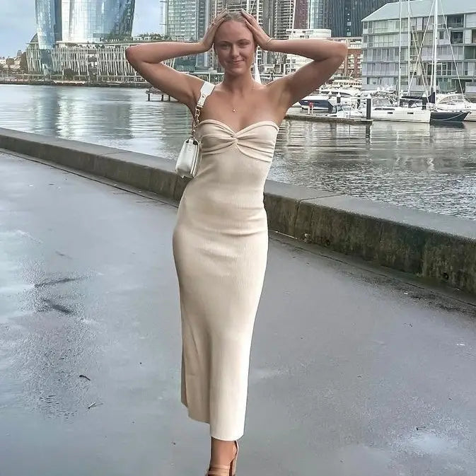 Beige ribbed strapless midi dress with a front knot detail made of knit fabric for an elegant off shoulder look.