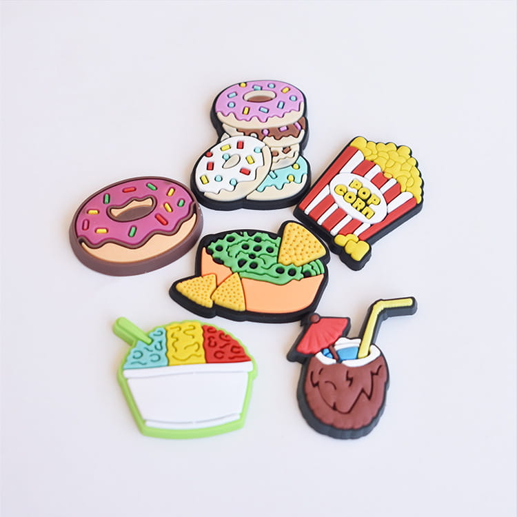 Colorful silicone food themed shoe charms in assorted designs including donuts popcorn and tropical drinks for sandals and clogs.