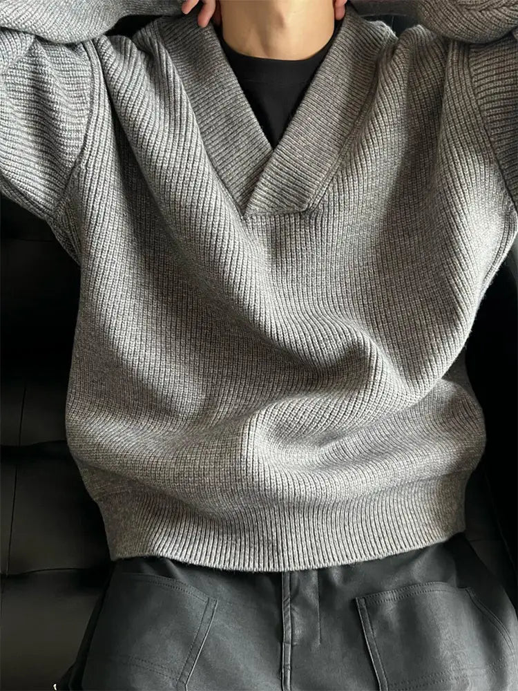 A cozy heather gray ribbed knit v-neck pullover sweater with soft textured fabric and a relaxed fit.