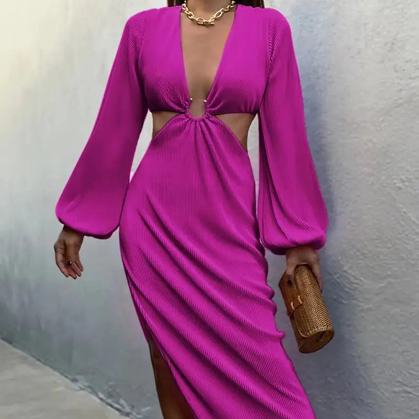 Vibrant fuchsia ribbed long sleeve maxi dress featuring a deep v neck and side cutouts.