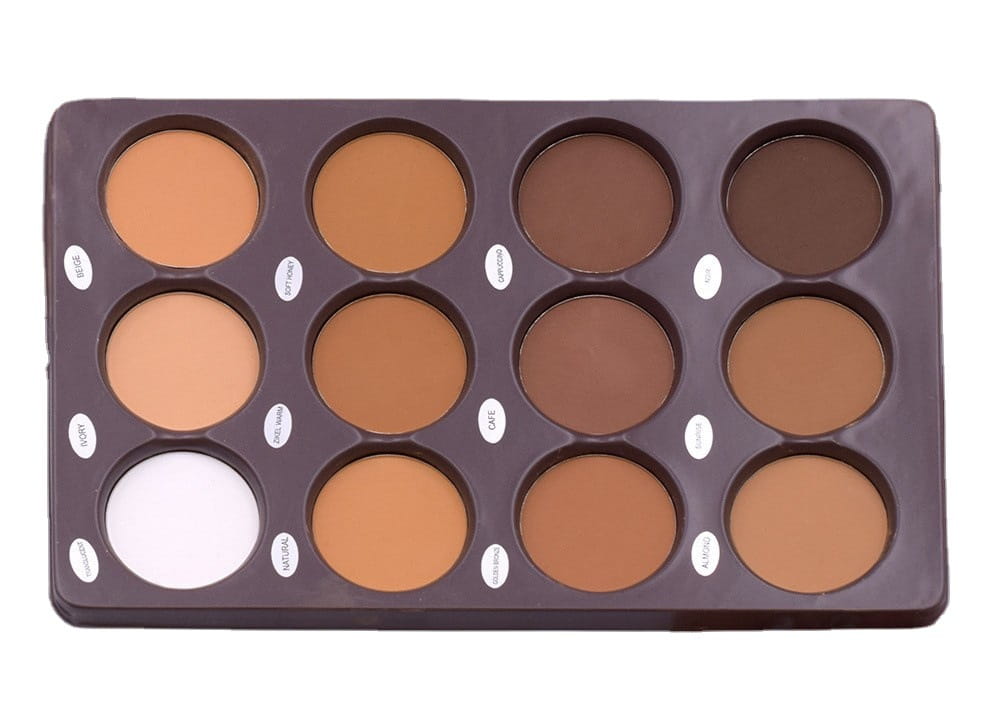 A dark brown rectangular 12 color contour palette with matte face sculptor powder featuring 12 circular pans of concealer in various shades including one white pan.