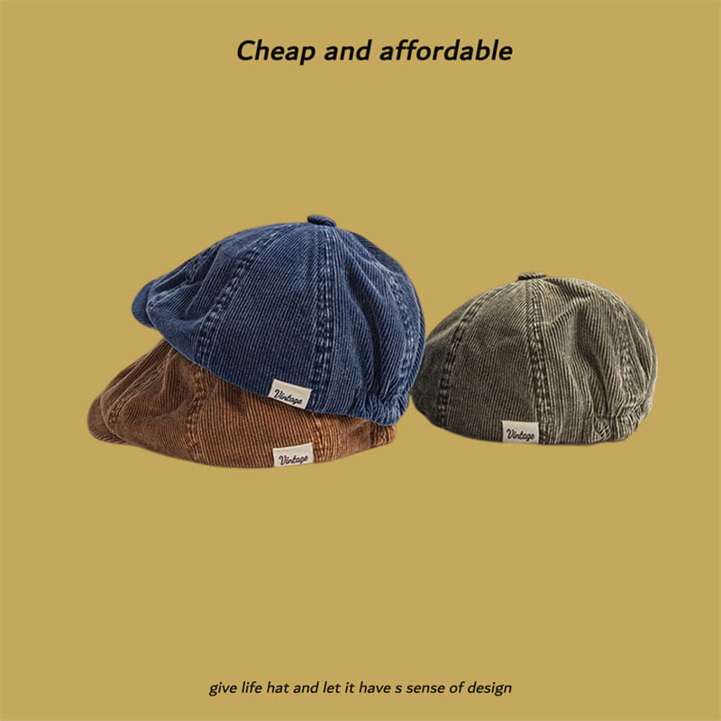 Three corduroy eight panel retro newsboy caps in blue brown and olive green displayed side by side.