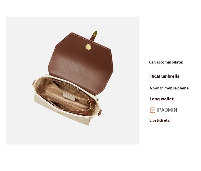 Eine zweifarbige Webleder-Crossbody-Handtasche in Braun mit goldtönigem Verschluss und Innenfutter.
