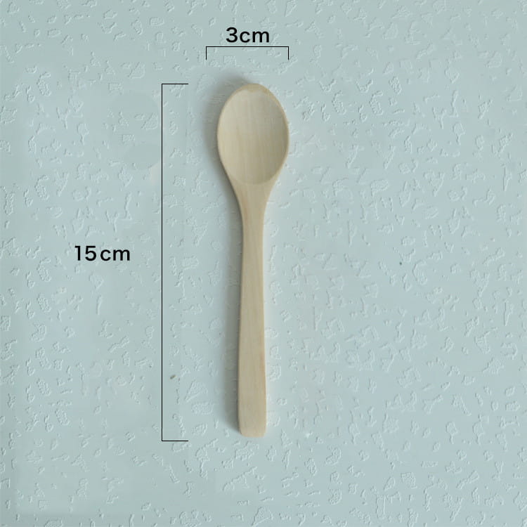 A light beige wooden spoon with a smooth natural finish and simple oval-shaped bowl from a wooden spoon set natural eco-friendly kitchen utensils.