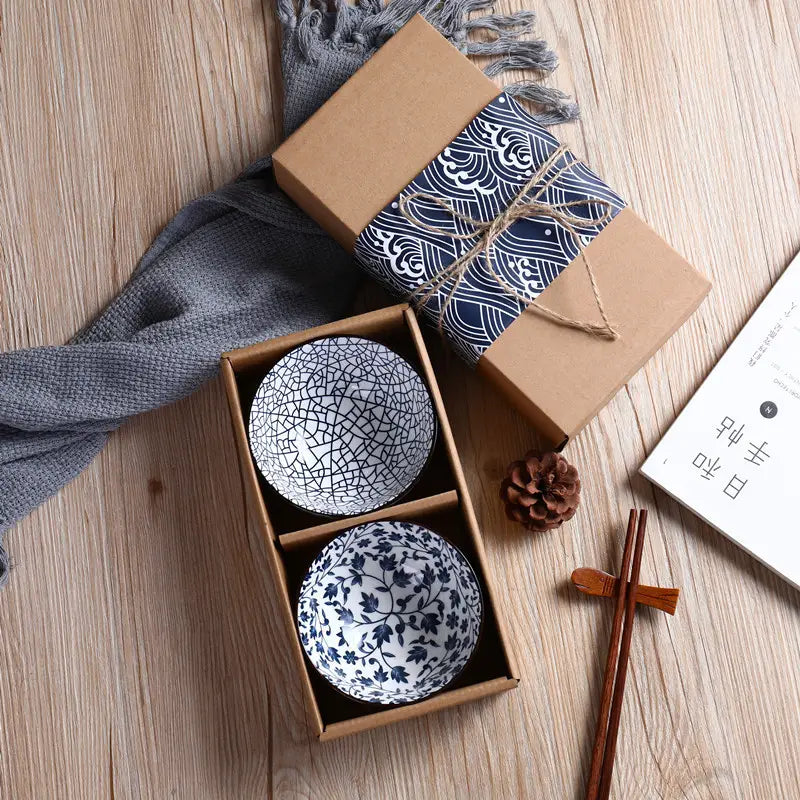 Set of two blue and white ceramic bowls with crackle glaze patterns including a delicate floral design from the Japanese tableware set blue ceramic floral bowl 10 piece.