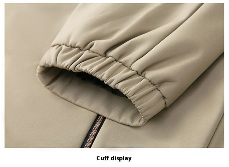 Beige men casual polo bomber jacket cuff with elasticated hem and zipper detail on a puffer material.