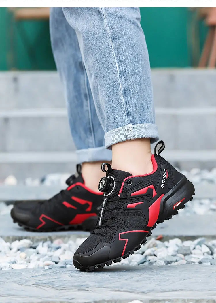 Black and red x111 lightweight off-road breathable hiking shoes featuring a distinctive circular lace system for enhanced outdoor performance.