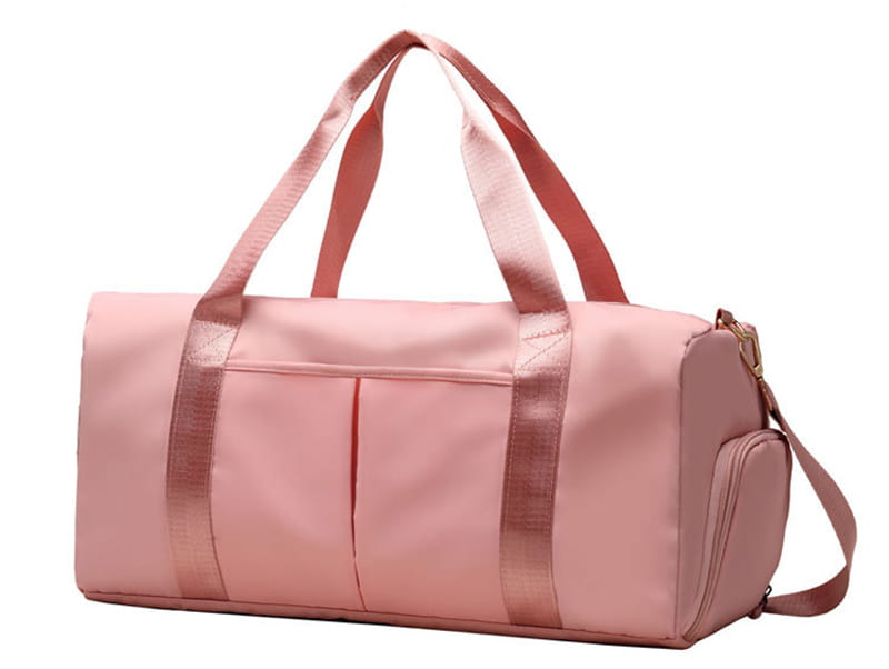 Pink nylon waterproof oxford travel duffel bag with rose gold trim and adjustable shoulder strap designed for gym and sports use.