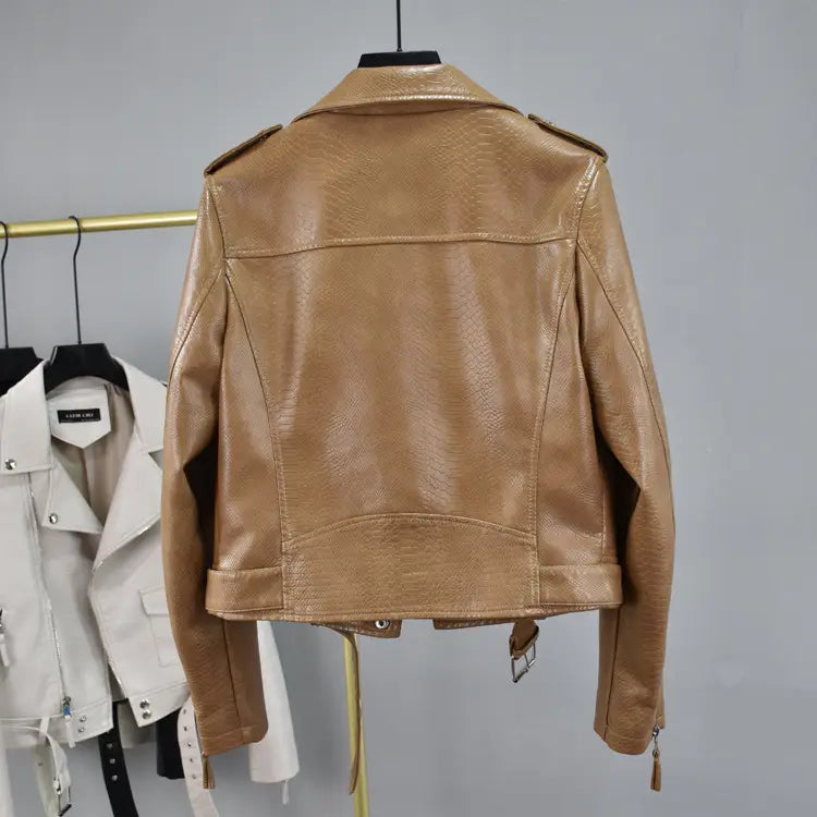 Tan faux leather cropped biker jacket with belt featuring a subtle crocodile texture and classic moto design.