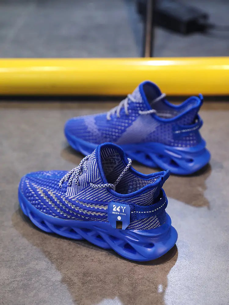 Vibrant blue flyknit mesh platform running shoes for men featuring a bold sculpted sole and silver laces.