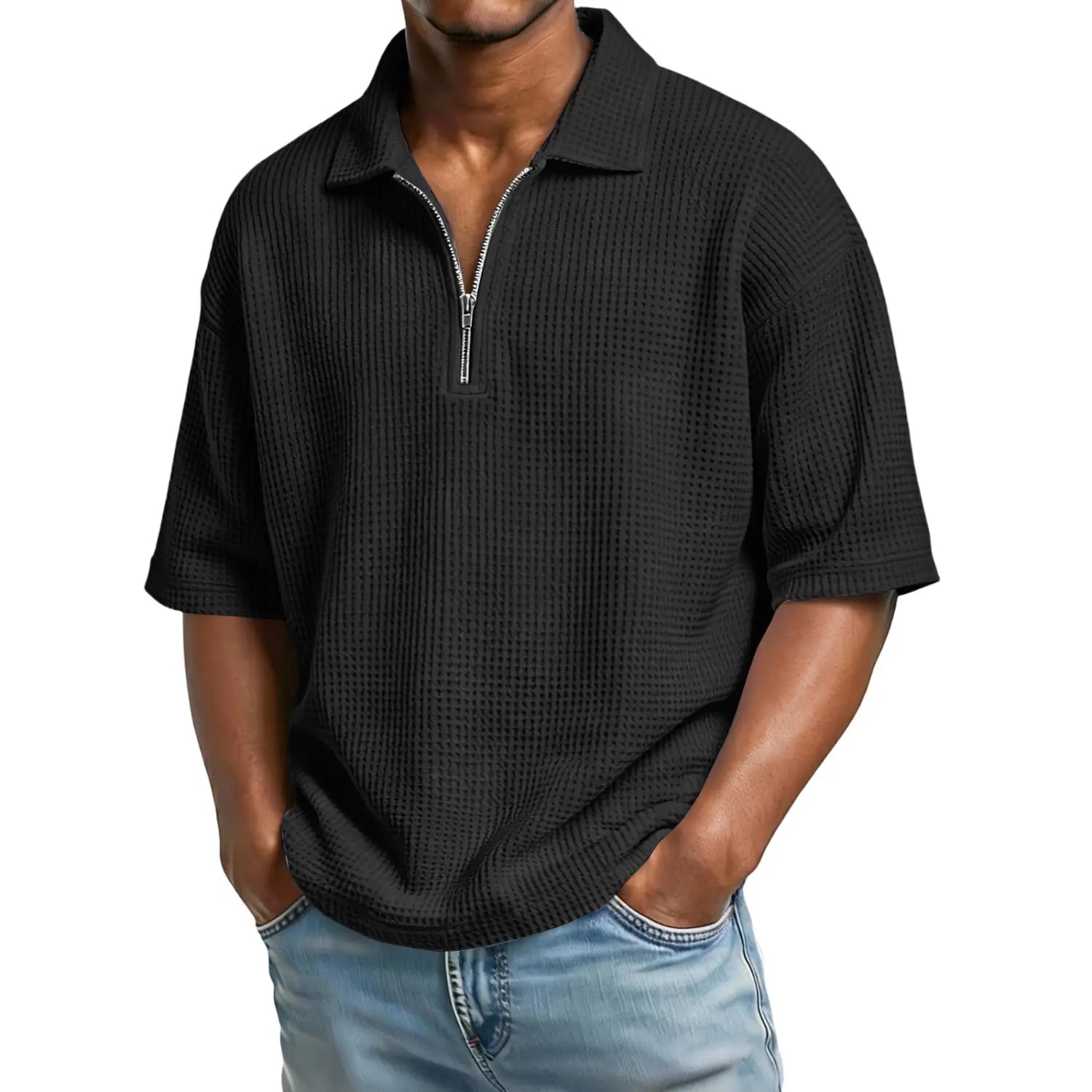 Black waffle knit men’s polo shirt with half zip front and short sleeves.