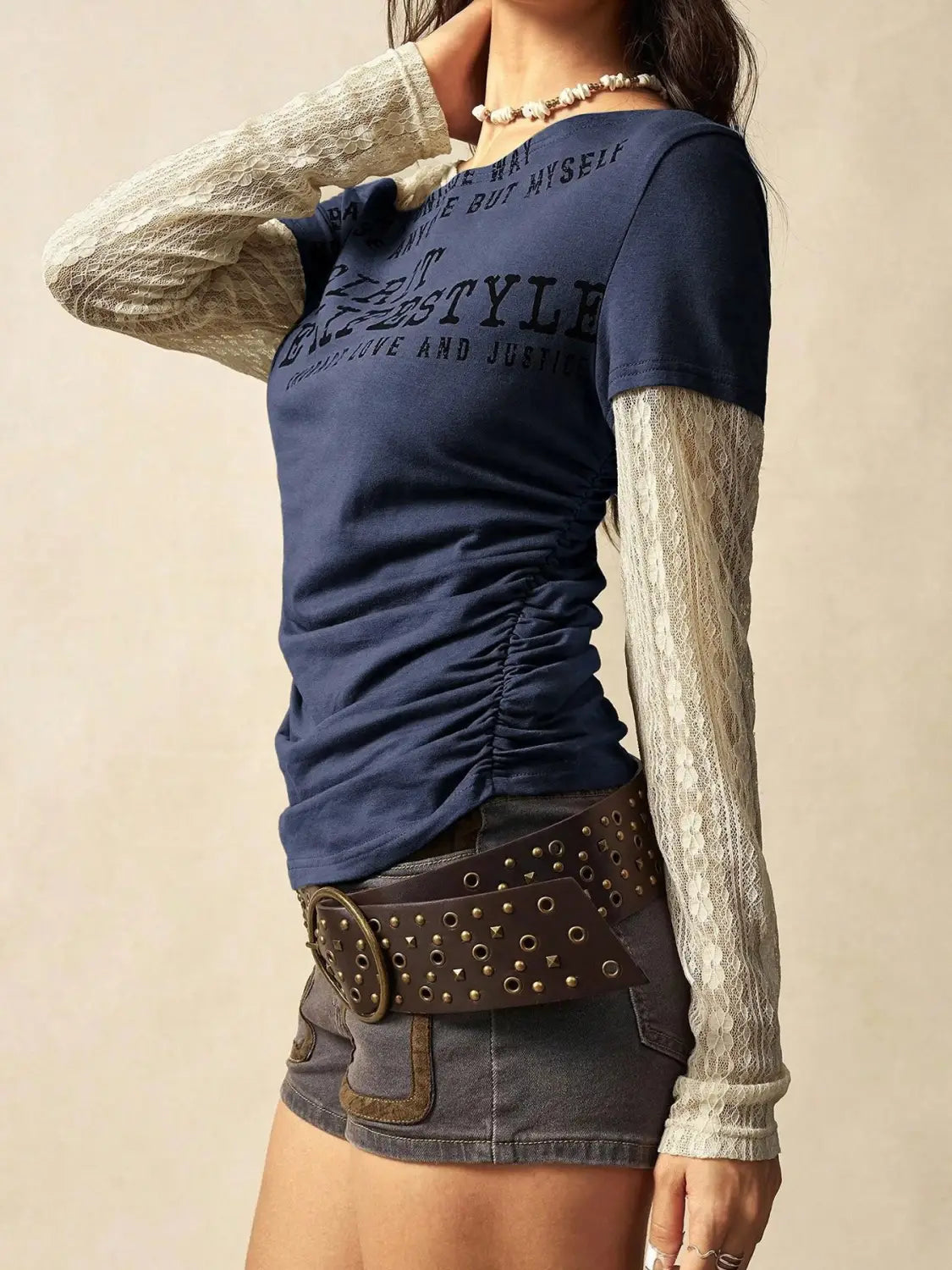 Navy blue lace layer off shoulder knitted top featuring lace sleeves and a ruched side seam.